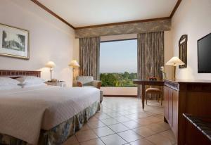 Postelja oz. postelje v sobi nastanitve Hyatt Regency Yogyakarta