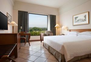 Postelja oz. postelje v sobi nastanitve Hyatt Regency Yogyakarta