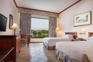 Postelja oz. postelje v sobi nastanitve Hyatt Regency Yogyakarta