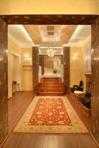 a large lobby with a hallway with a stair case at Acropolis Museum Boutique Hotel in Athens