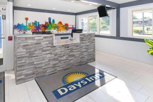 a rendering of a davisavis office with a lobby at Days Inn by Wyndham Knoxville North in Knoxville