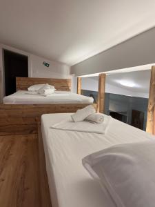 Postel nebo postele na pokoji v ubytování APARTMA NIKA