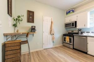 a kitchen with a table and a stove top oven at Stay with Jay Cleveland One in Cleveland