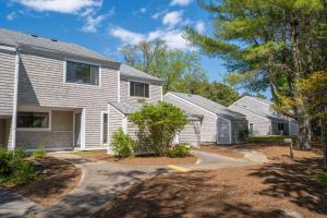 a house with white siding and a driveway at Southcape Resort Mashpee a Ramada by Wyndham in Mashpee