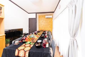 a long dining room with a long table at 6BR 10Beds Direct to Shinjuku, Shibuya ,Tokyo Dome, Central ,Budget Friendly in Tokyo