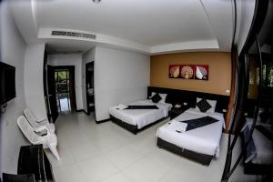 Postel nebo postele na pokoji v ubytování Naiyang Beach Hotel SHA Plus
