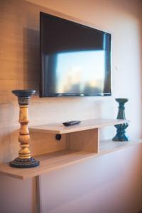 Μια τηλεόραση ή/και κέντρο ψυχαγωγίας στο APARTAMENTO CENTRiCO 2 DORMITORIOS AMPLIO BALCON CON OPCION COCHERA