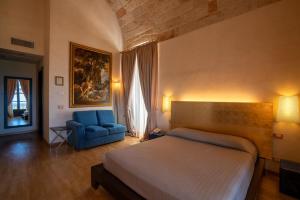 Postel nebo postele na pokoji v ubytování San Tommaso Hotel + 37 fotografií