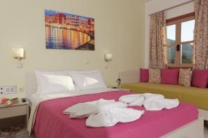 Postel nebo postele na pokoji v ubytování Latania Apartments