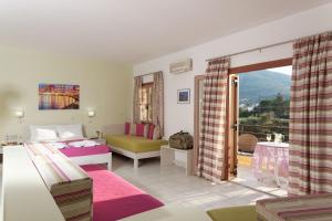 Postel nebo postele na pokoji v ubytování Latania Apartments