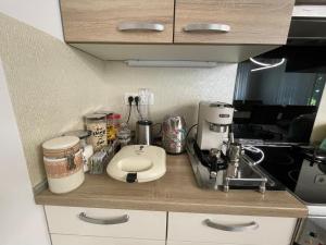 a kitchen counter with a coffee maker on it at Apartment Armic in Ljubljana