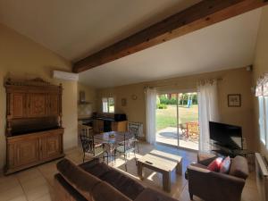 a living room with a couch and a table at GITE DE NOGAROLS in Prades