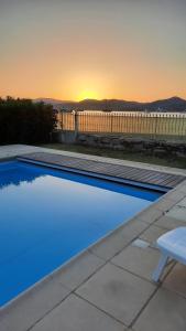 a swimming pool with a sunset in the background at Villa Playa del Sol -B4 in Saint-Tropez +12 photos