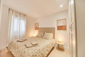 Ένα ή περισσότερα κρεβάτια σε δωμάτιο στο Apartamento Cervantes