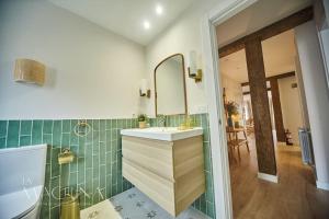 a bathroom with a sink and a mirror at Apartamento Cervantes in Santander