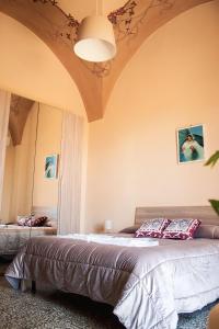 a bedroom with a large bed in a room at Casa Antonella in Acireale