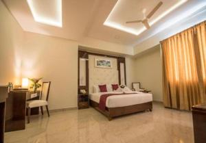 Postel nebo postele na pokoji v ubytování Hotel Star Palace - Rameswaram Tamil Nadu