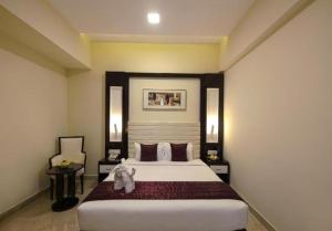 Postel nebo postele na pokoji v ubytování Hotel Star Palace - Rameswaram Tamil Nadu