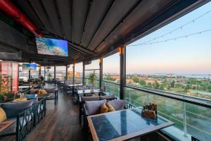 a restaurant with tables and chairs with a view at Grand Abimo Hotel in Istanbul