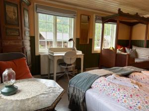 Postel nebo postele na pokoji v ubytování Sevletunet B&B and Cabins + 37 fotografií