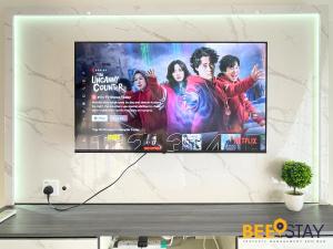 a flat screen tv hanging on a wall at JB SeaView with Balcony Country Garden Danga Bay for 6 Pax in Johor Bahru
