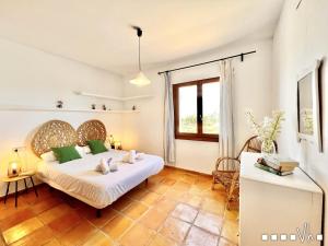 Ein Bett oder Betten in einem Zimmer der Unterkunft VH CostaBlanca - MARIPOSA