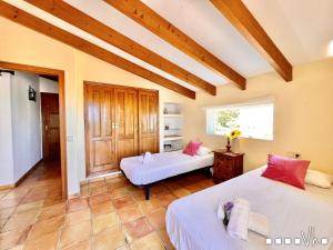 Ein Bett oder Betten in einem Zimmer der Unterkunft VH CostaBlanca - MARIPOSA