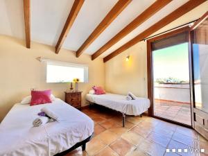 Ein Bett oder Betten in einem Zimmer der Unterkunft VH CostaBlanca - MARIPOSA