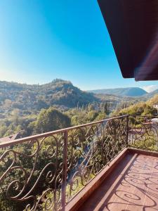 a balcony with a view of a valley at Гостевой Дом Феникс in Sukhum