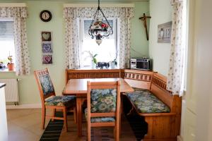 a dining room with a table and chairs and a window at Ferienhaus Drasch in Lalling