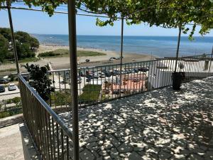 a balcony with a view of a beach and the ocean at Apartments Doda in Ulcinj