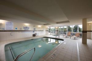 a large swimming pool in a hotel room at Courtyard Atlanta McDonough in McDonough