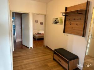a room with a hallway with a room with a bed at Vala Apartments in Rovinj