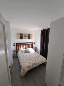 a bedroom with a bed and a window at ACC Seminario Park Paradise in Jaén