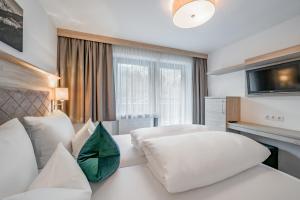 Voodi või voodid majutusasutuse rechenau LIVING & RELAX toas