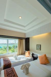 Voodi või voodid majutusasutuse Excella Hotel toas