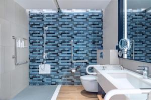 a bathroom with a toilet and a sink and a shower at Fairfield by Marriott Beijing Daxing Airport in Beijing
