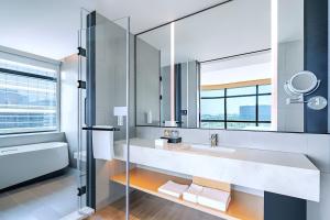a bathroom with a sink and a mirror at Fairfield by Marriott Beijing Daxing Airport in Beijing