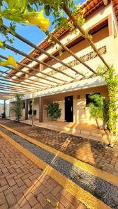 a courtyard of a building with a patio at JACY AP GOSTOSO in São Miguel do Gostoso