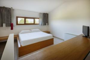 Postel nebo postele na pokoji v ubytování Precise House Montaperti Siena