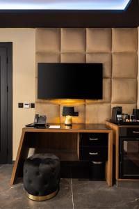 TV a/nebo společenská místnost v ubytování Damare Resort & SPA