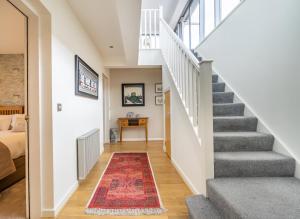 a staircase in a home with a rug at 11 Stonegate Court in York