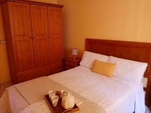 מיטה או מיטות בחדר ב-Casa Palmés