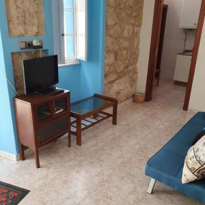 TV a/nebo společenská místnost v ubytování Casa típica de mariscadores + 10 fotografií