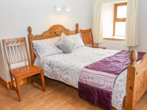 Postel nebo postele na pokoji v ubytování Clogher Cottage