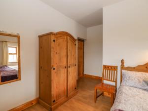 Postel nebo postele na pokoji v ubytování Clogher Cottage