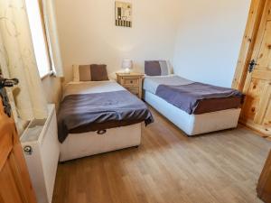 Postel nebo postele na pokoji v ubytování Clogher Cottage