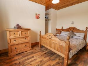 Postel nebo postele na pokoji v ubytování Clogher Cottage