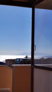 a view of the ocean from a window at Kallistis Beach House in Monolithos