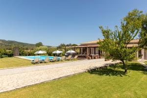 an image of a villa with a swimming pool at Villa Sand Dune in Agios Georgios